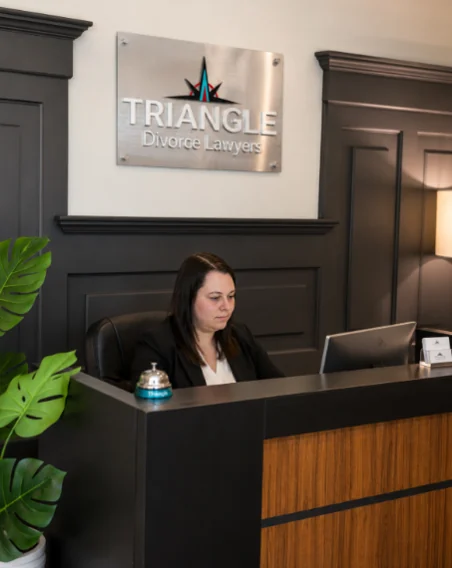 A Triangle Divorce Lawyers team member at the front desk of the firm's office