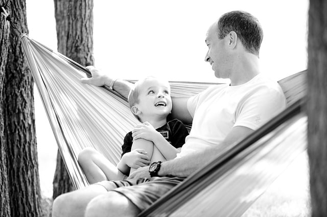 father and son on a hammock