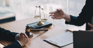 Lawyers give advice about judgment, agreements, Consultation of Businesswoman and Male lawyer or