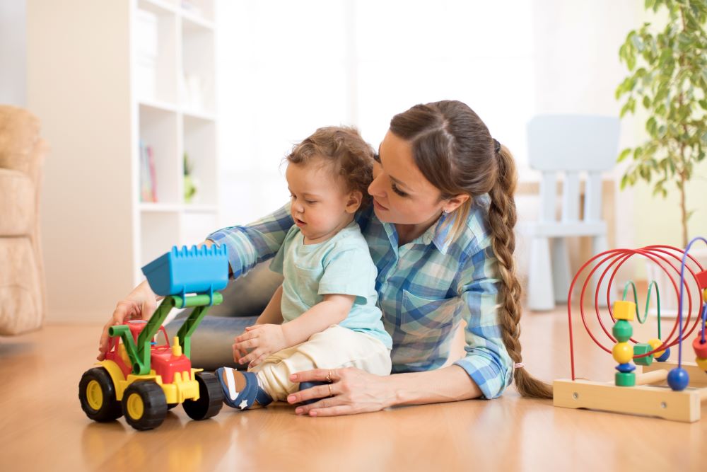 child and mom playing with toys