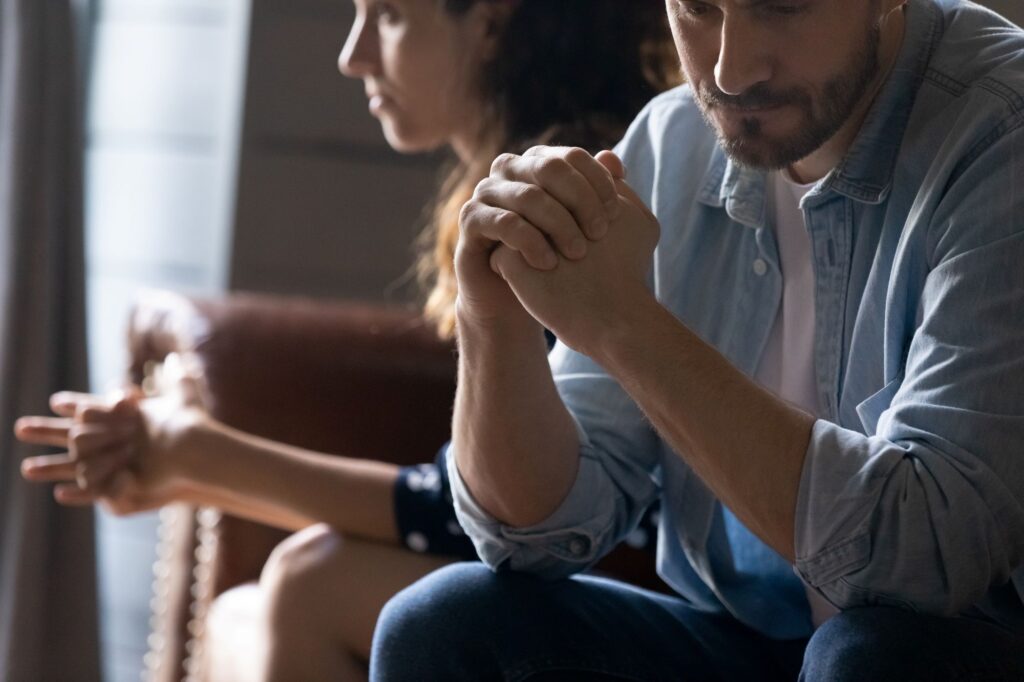 couple sitting apart