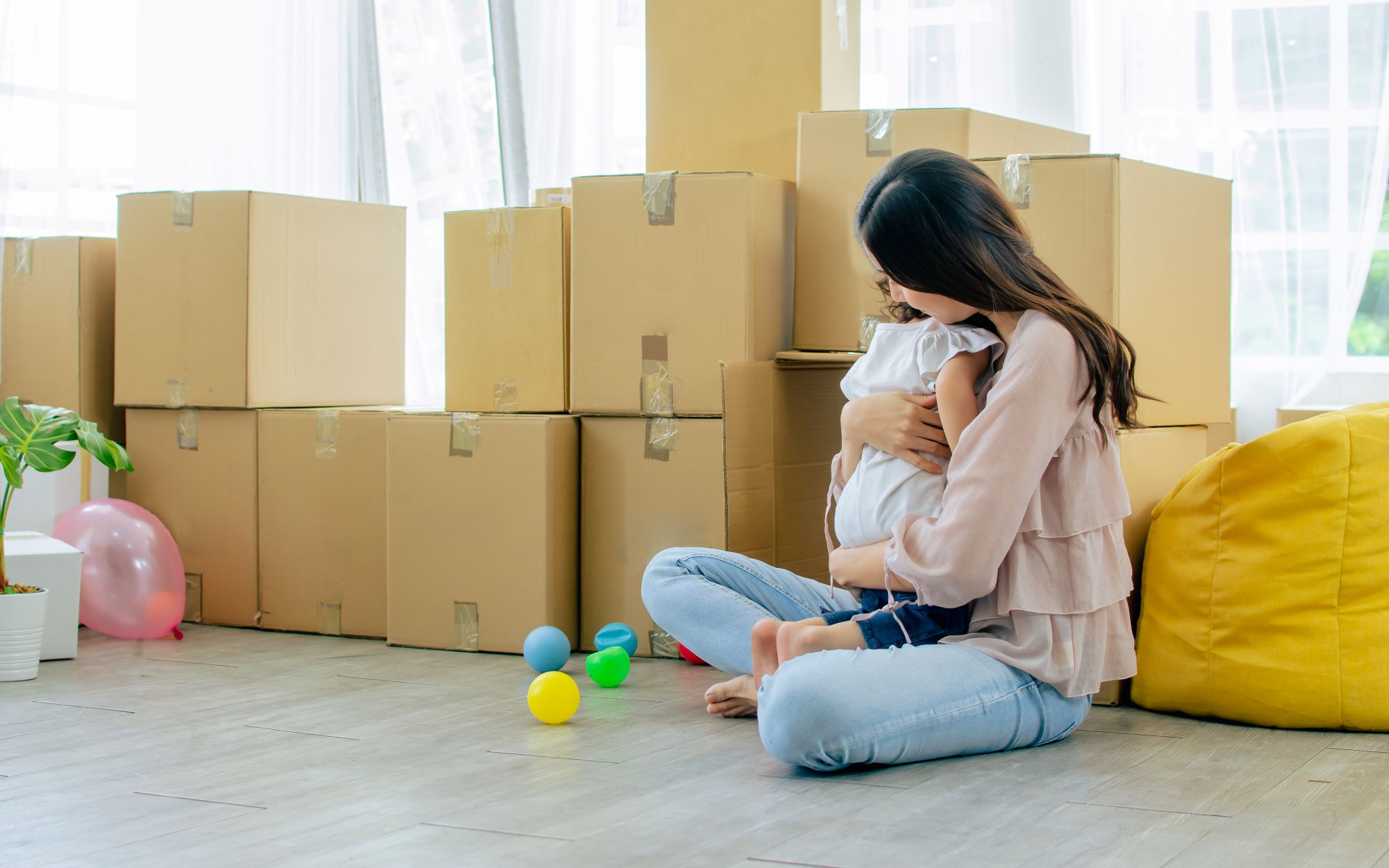 parent with child and moving boxes