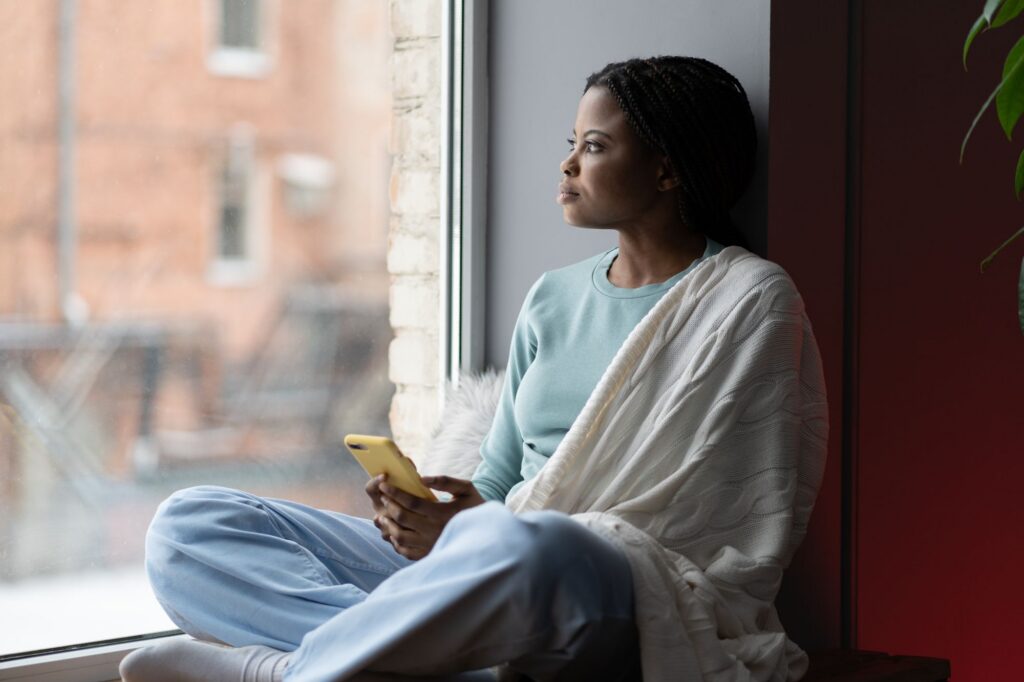 woman looking out of window